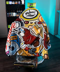 A barber chair draped in a vibrant, graffiti-style printed cape featuring a dog illustration and bold graphic text